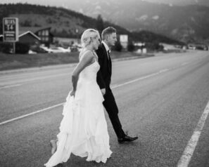 Bride and groom crossing road