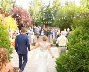 Brinde and groom approaching crowd