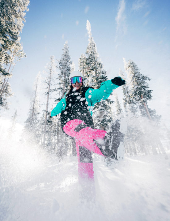 Person in ski gear playing in the snow