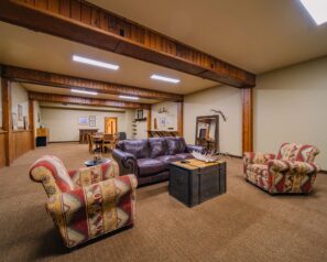 A large room with rustic decor and western themed furniture